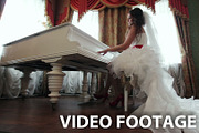 Bride playing the piano indoors