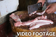 man's hand cut fresh meat