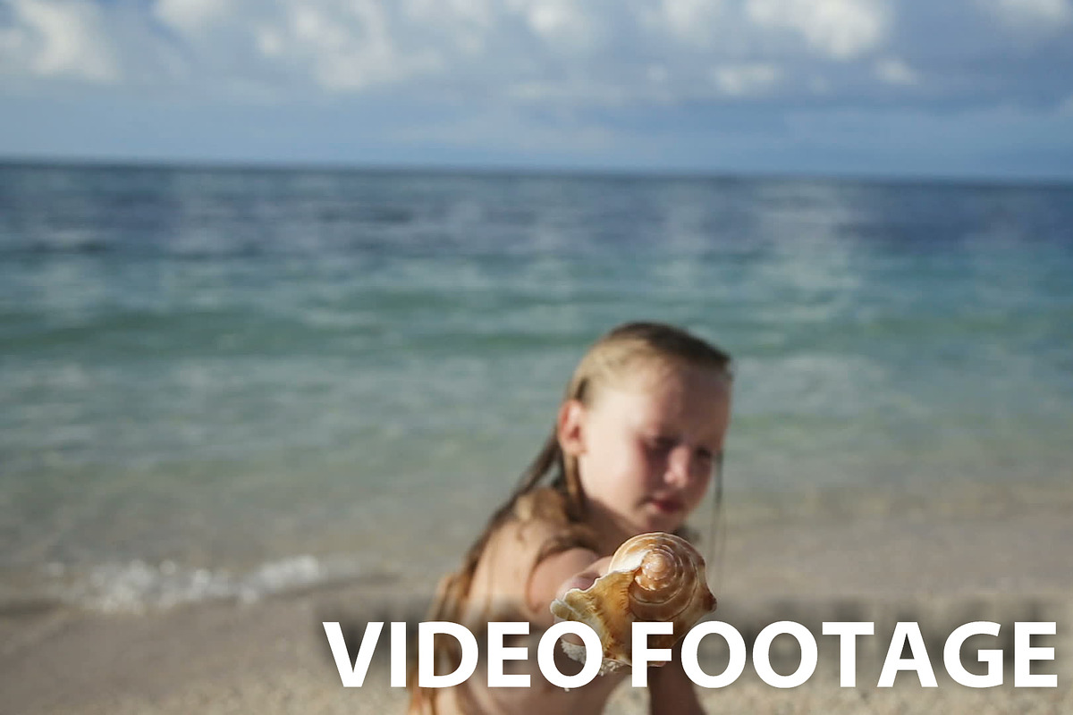 Child holding a seashell in Graphics - product preview 8