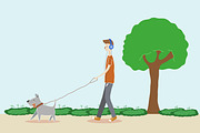 Boy walking the dog in the park