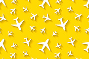 White airplane icons on yellow