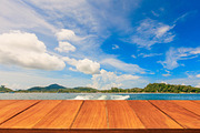 Wood table top on tropical ocean
