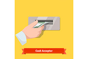 Hand putting banknote to a validator