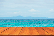 Wood table top on tropical sea
