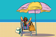 Girl in a deckchair on the beach