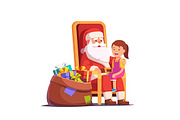 Santa Claus holding girl on knees