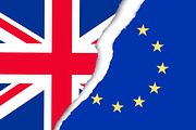 Two torn flags - EU and UK. 