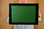 Sexy girl i taking photo frame with green back ground