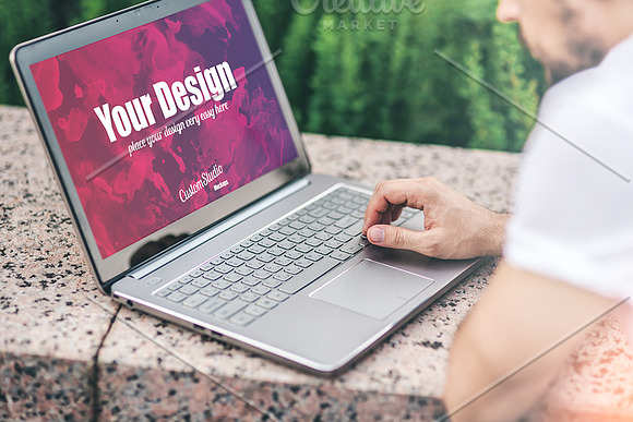 Man with Laptop PSD Mockup outdoors in Mobile & Web Mockups - product preview 1