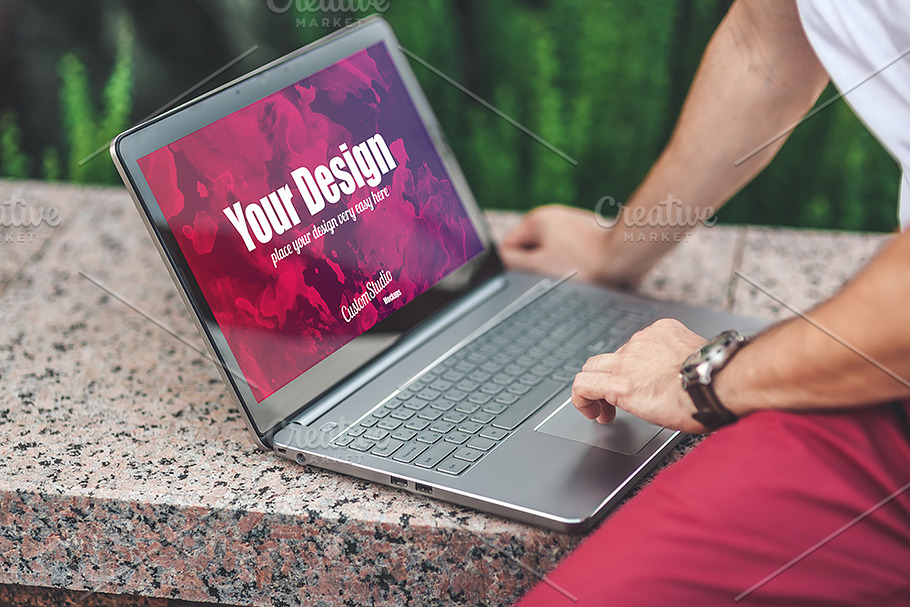 Man uses Laptop PSD Mockup outdoors in Mobile & Web Mockups - product preview 8