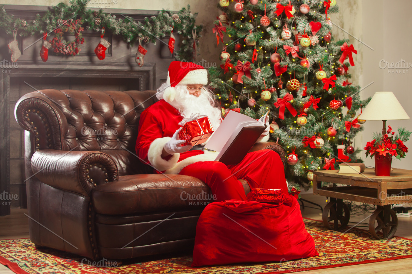 Santa Claus sitting at his home in a comfortable chair and ...