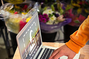 Florist using laptop