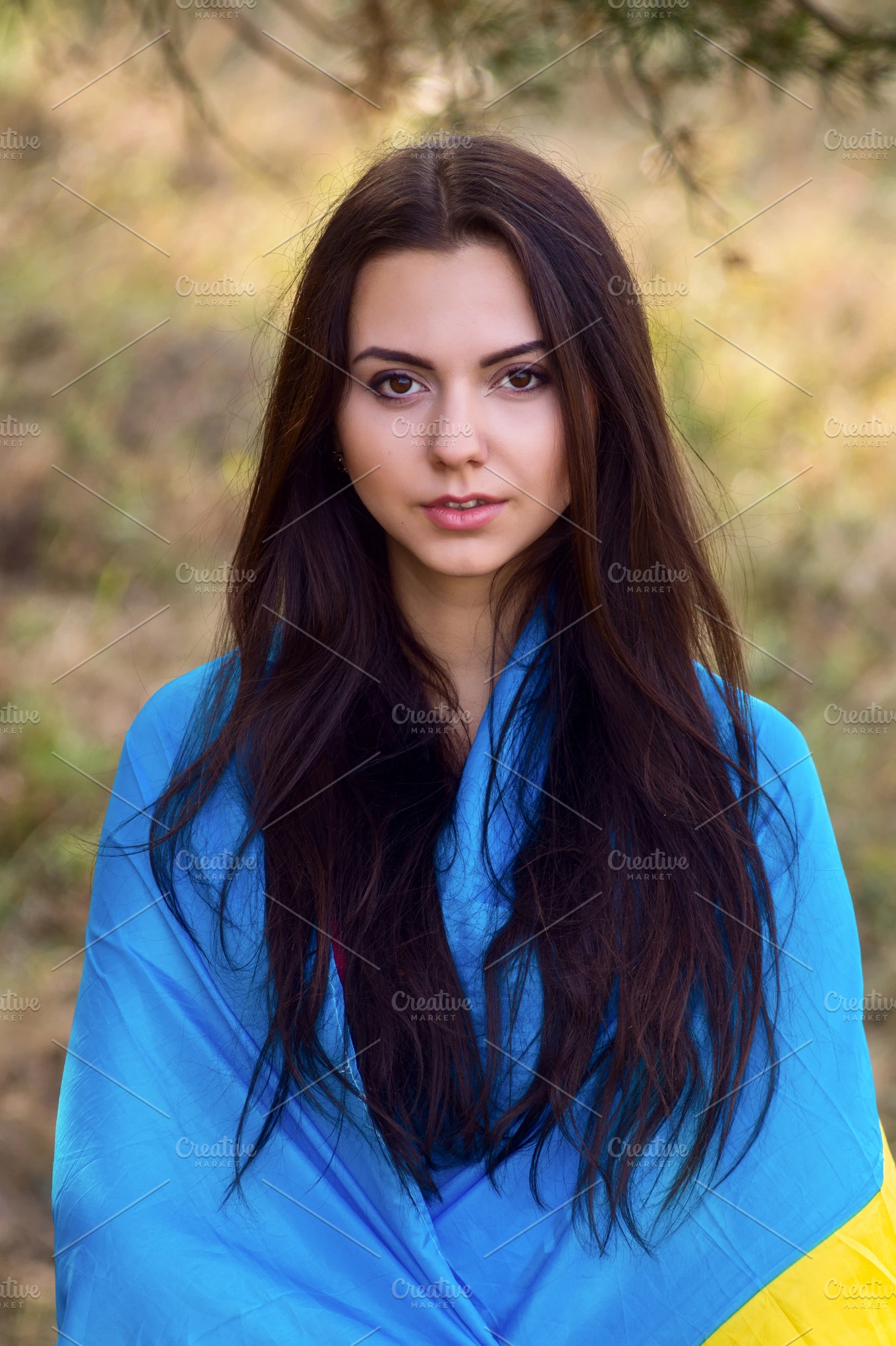 Beautiful brunette model posing in a park with flag of Ukraine ~ People ...