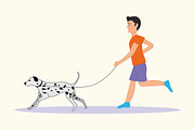 Man or boy with dog breed Dalmatian