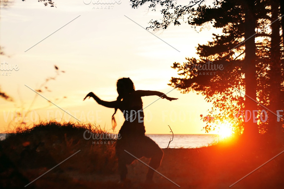 silhouette of young woman dancing in sunset in Graphics - product preview 8