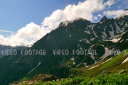 High Snowy Mountains and Green Hills, Clouds Timelapse. Kavkaz region