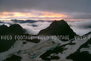 Sunset of High Snowy Tops of Mountains with Clouds Timelapse. Kavkaz region