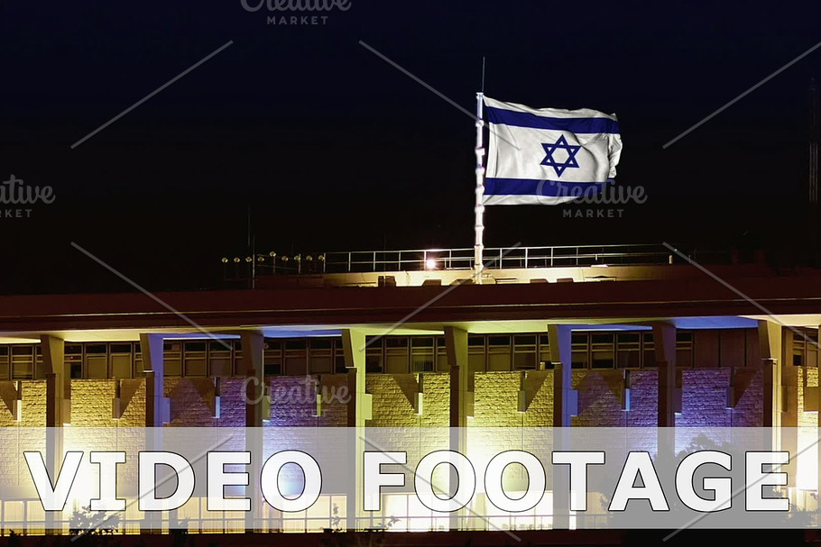 Knesset with flying waving flag of Israel at night