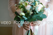 Woman holding wedding bouquet
