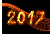 Happy new year 2017 isolated numbers written with flame fire sparkle light on black background elegant wave