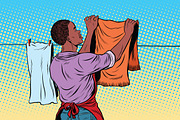Vintage employee hangs up to dry clothes