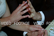 Hands of bride and groom holding a cup of coffee