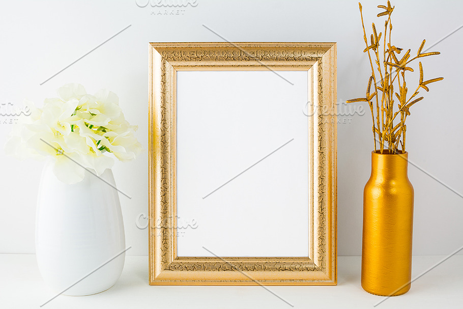 Gold frame mockup with golden vase