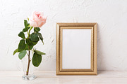 Gold frame mockup with pink rose