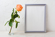 Silver frame mockup with orange rose