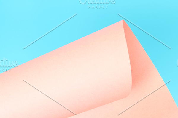 Pink paper on blue background.