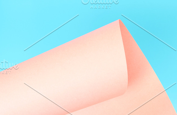 Pink paper on blue background. in Textures - product preview 1
