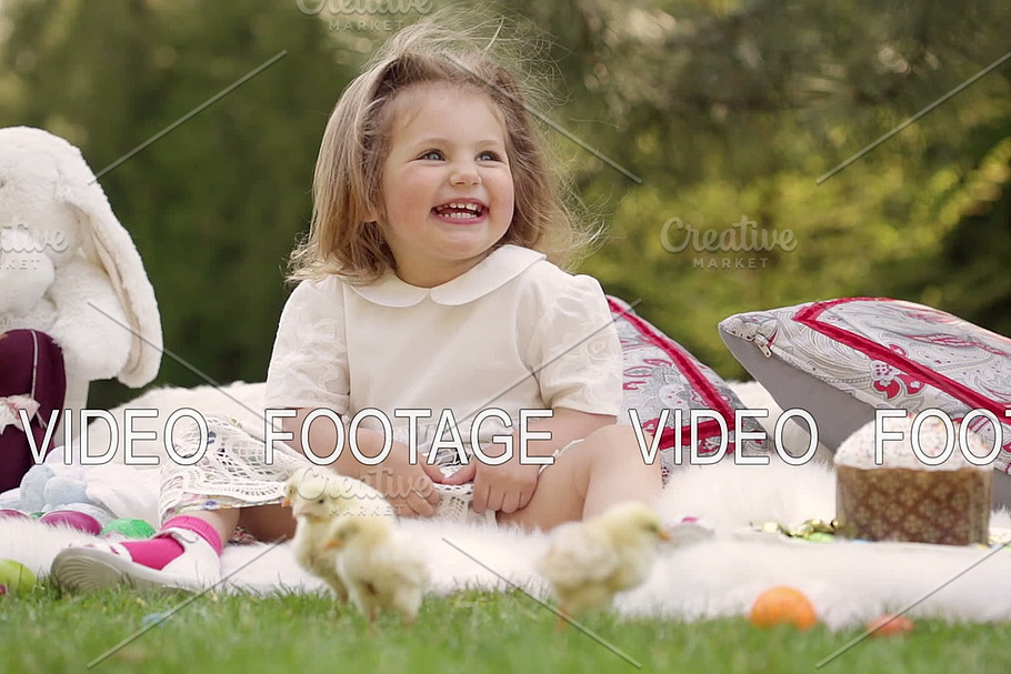 Happy child sits on a meadow around Easter decoration in Graphics - product preview 8