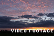 Sunset over the field. Time-lapse