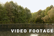 Backwater with dried waterfall. Autumn daytime. Smooth dolly shot