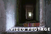 Running in the corridor in the abandoned house. Smooth and slow steady cam shot