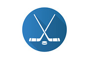 Hockey sticks and puck. Flat design long shadow icon