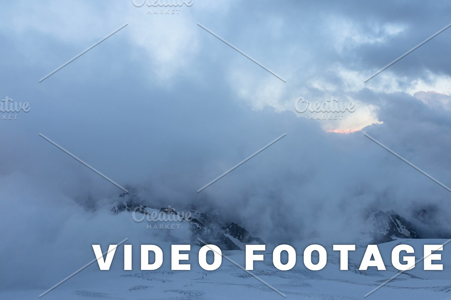 Sunset clouds moving in the mountains - Elbrus area