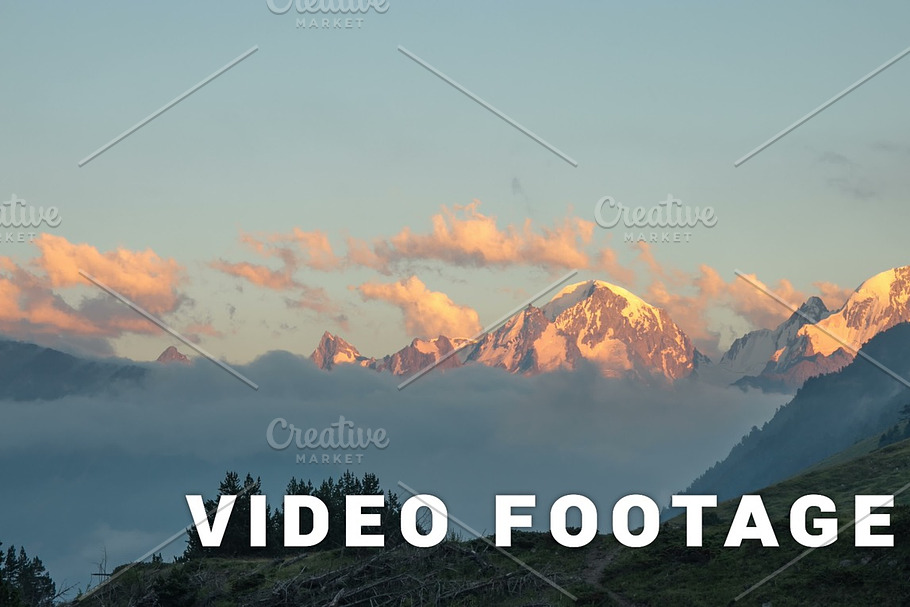 Sunset clouds over the mountain peak - Elbrus area, Russia. Time-lapse