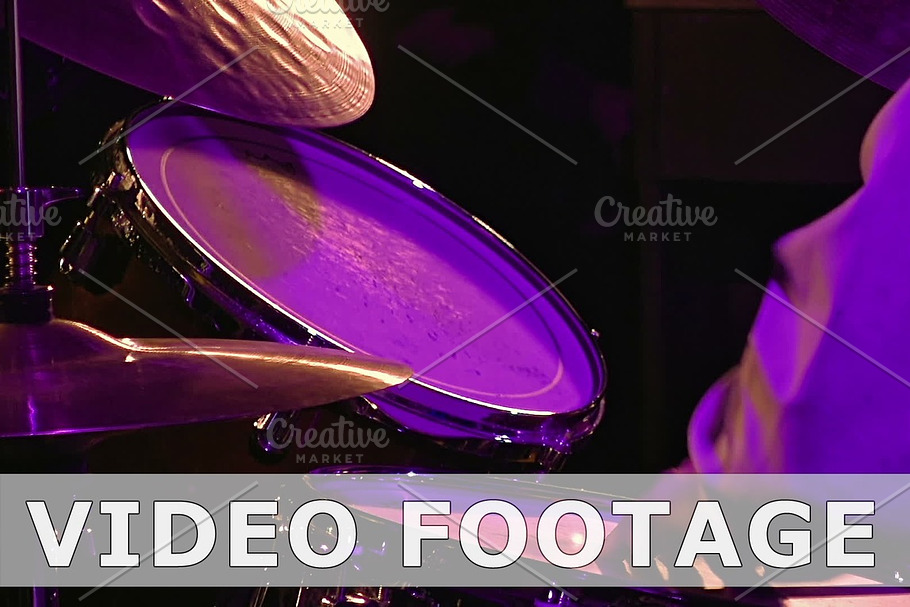 Drummer plays on drum set and cymbal