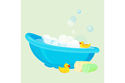 Bathtub for child full of bubbles and with duck toys