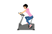 Woman trains riding an exercise bike
