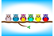 Funny colorful owls in a row