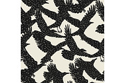 Seamless pattern with black flying ravens. Hand drawn inky birds