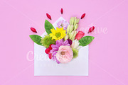 envelope full of various flowers