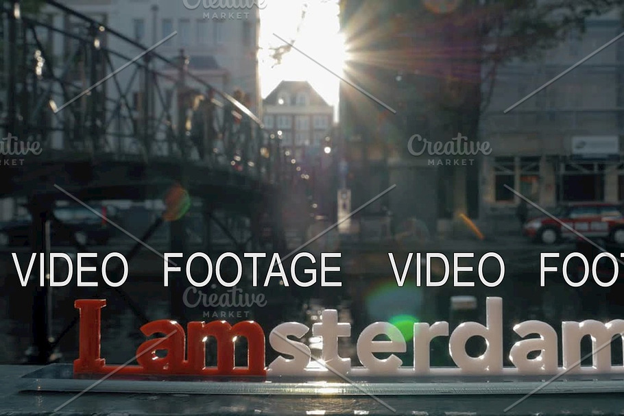 I amsterdam slogan and city view with canal in Graphics - product preview 8
