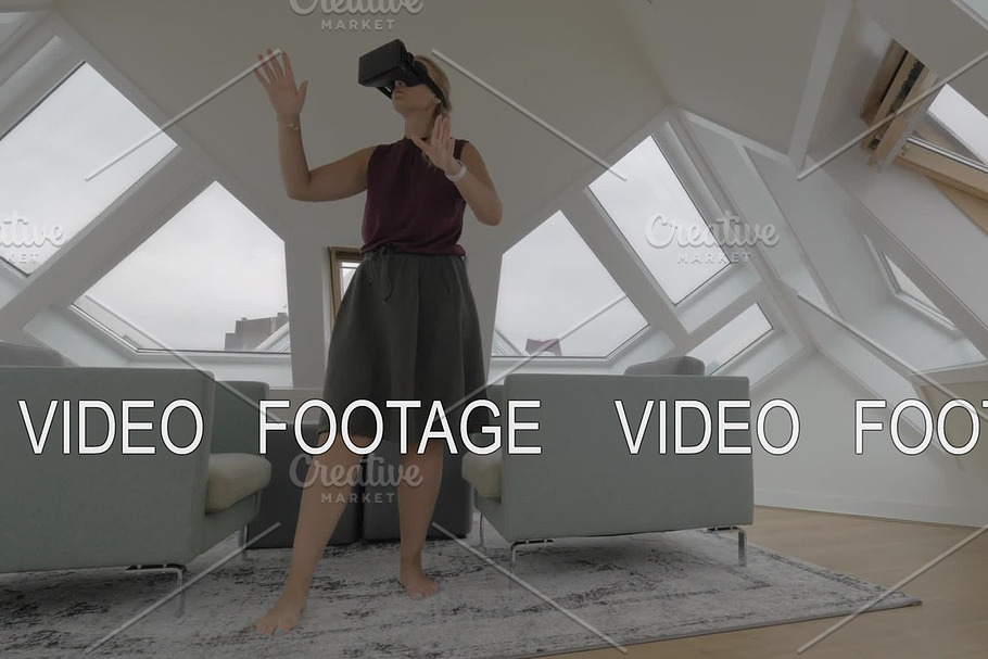 Woman entertaining with VR-headset in Cube House