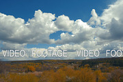autumn fields and forest with clouds timelapse
