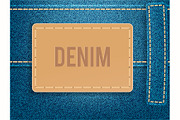 Leather label on blue denim fabric.