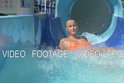 Woman going down water slide