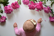 Little baby girl with pink peony on white background. Free place for text. Happy birthday. happy mother day. Happy father day
